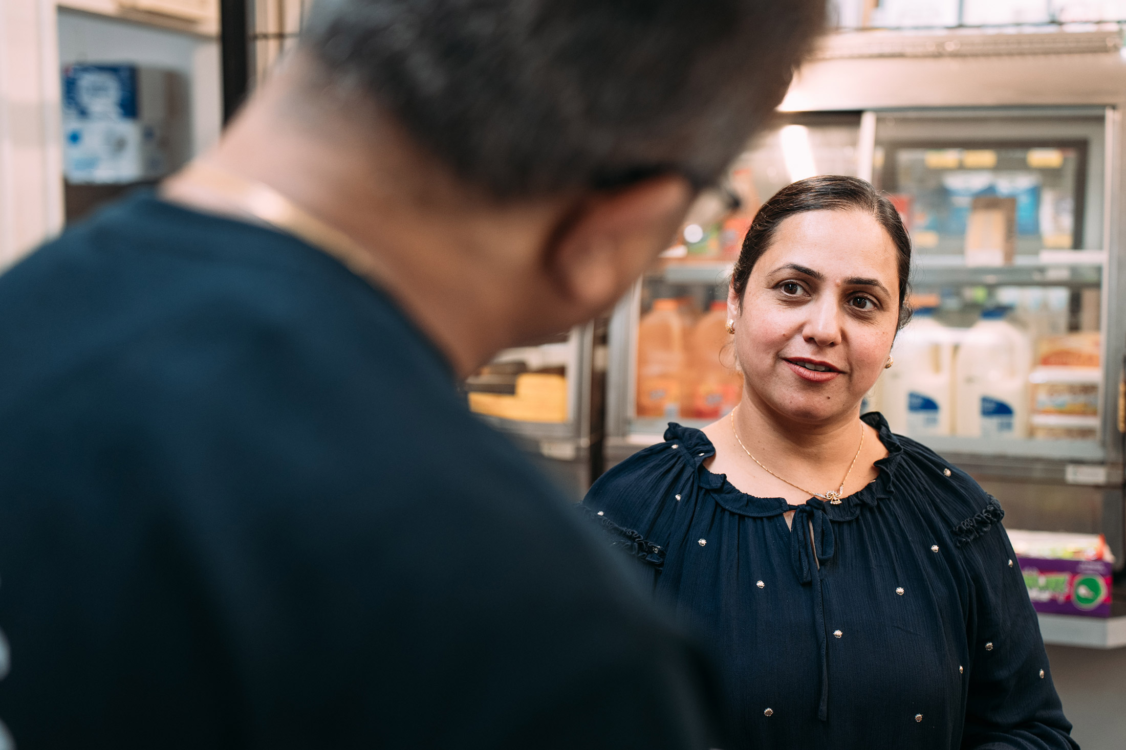 Over the shoulder shot of two people talking