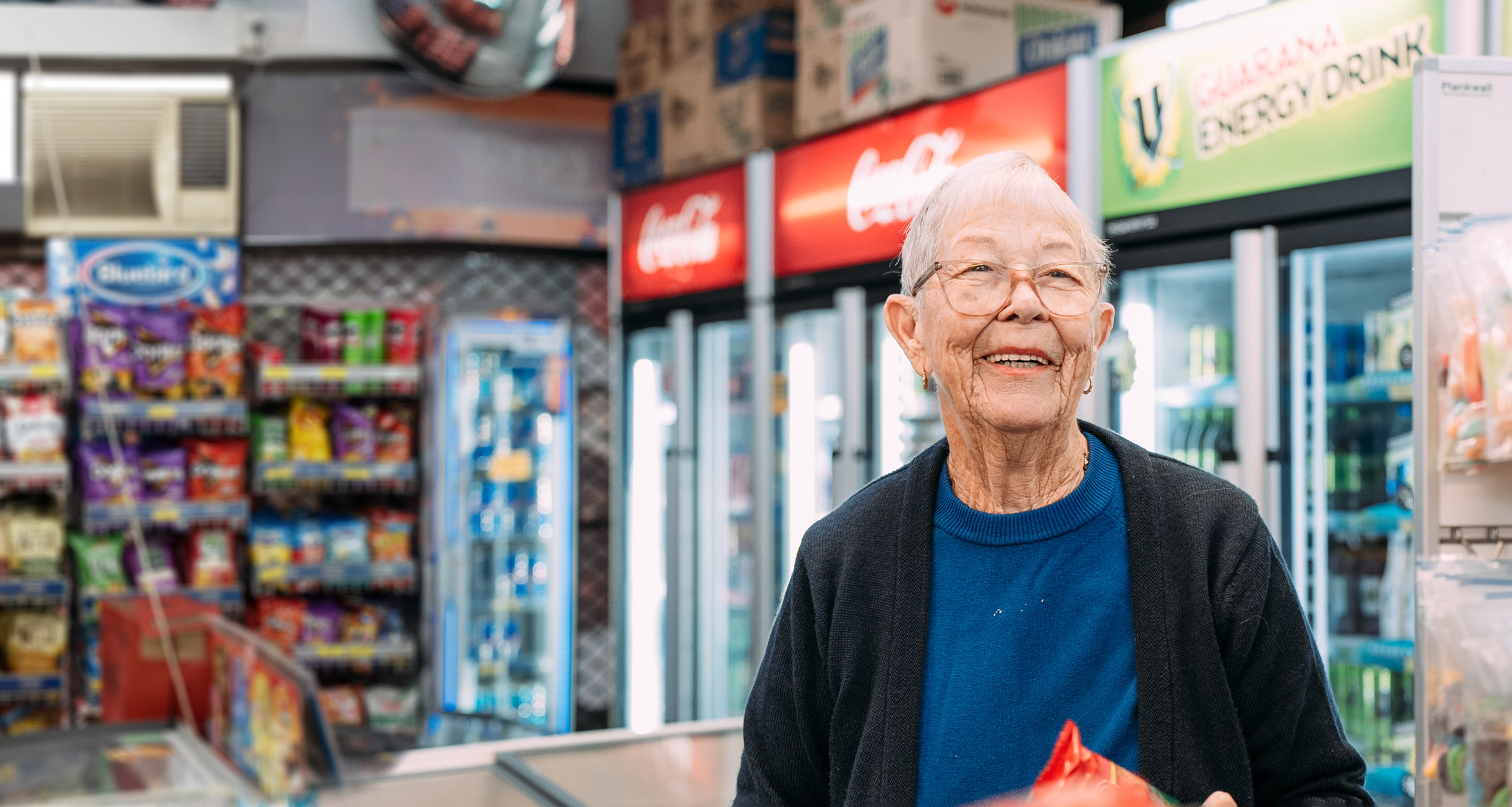 Elderly woman in a local dairy